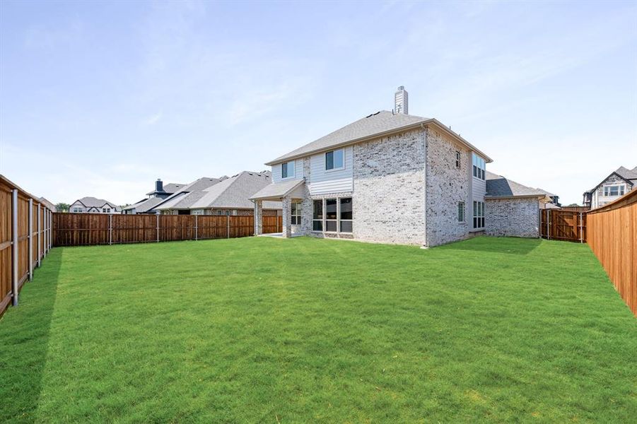 Front exterior of a new home in Mockingbird Hills 60-65, Joshua, TX, highlighting curb appeal (Image 2). Front exterior of a new home in Mockingbird Hills 60-65, Joshua, TX, highlighting curb appeal (Image 2).