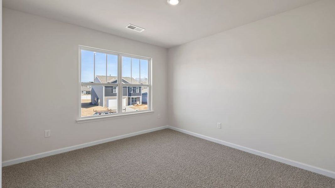 Spacious, unfurnished interior of a new home in Bentley Park, Greenwood (Image 30).
