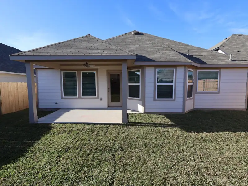 Exterior details and patio area of a home in Pinewood at Grand Texas, New Caney (Image 3).