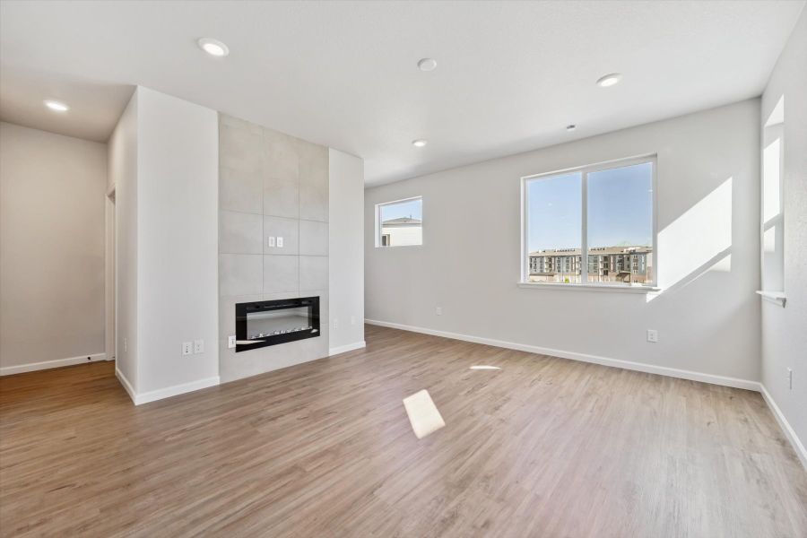 A room with white walls and a wood floor. A room with white walls and a wood floor.