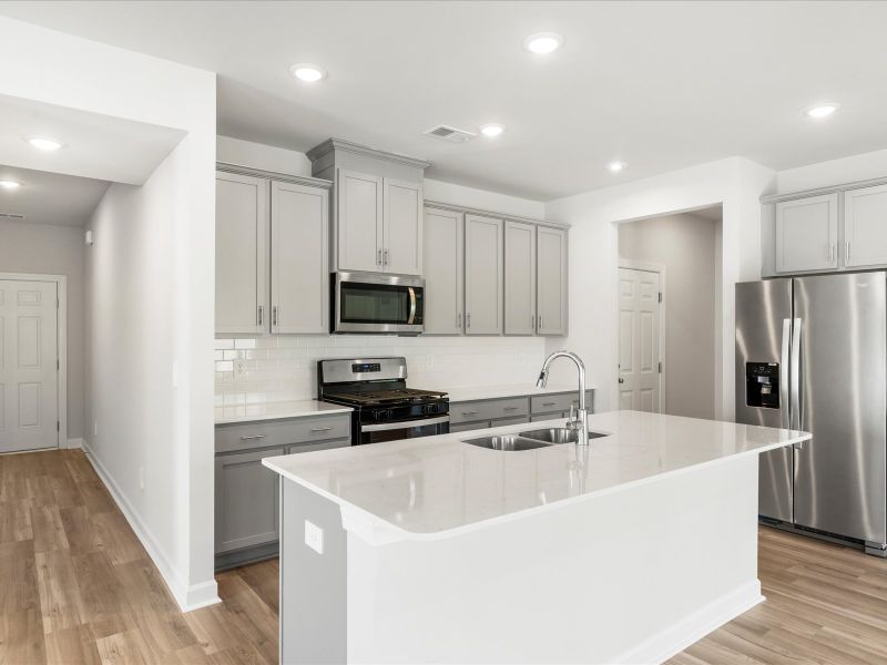 Furnished interior view inside a new home in The Farm at Wells Creek - Signature Collection, Gray Court (Image 7).