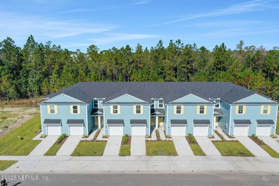 Front exterior of a new home in Atlantis Pointe, Middleburg, FL, highlighting curb appeal (Image 2).