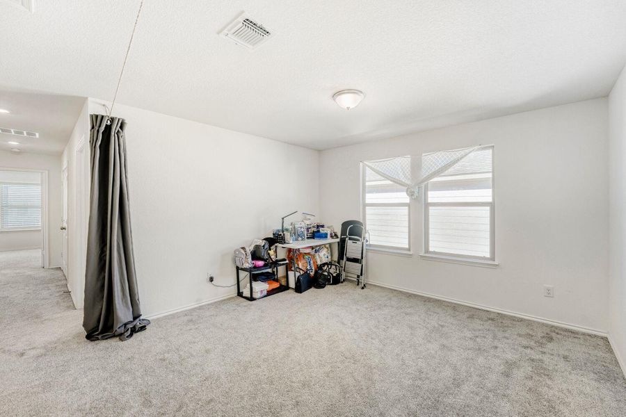 Miscellaneous room with carpet and baseboards