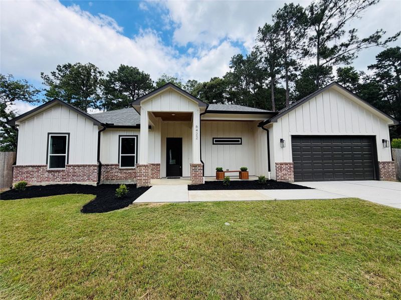 Front exterior of a new home in , Magnolia, TX, highlighting curb appeal (Image 19).