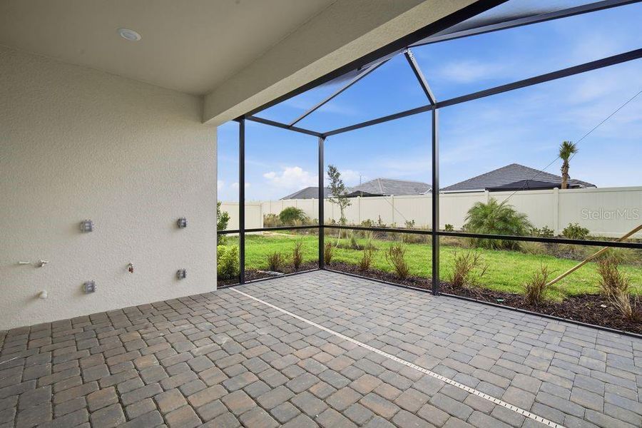 Exterior details and patio area of a home in Esplanade at Wiregrass Ranch, Wesley Chapel (Image 21).