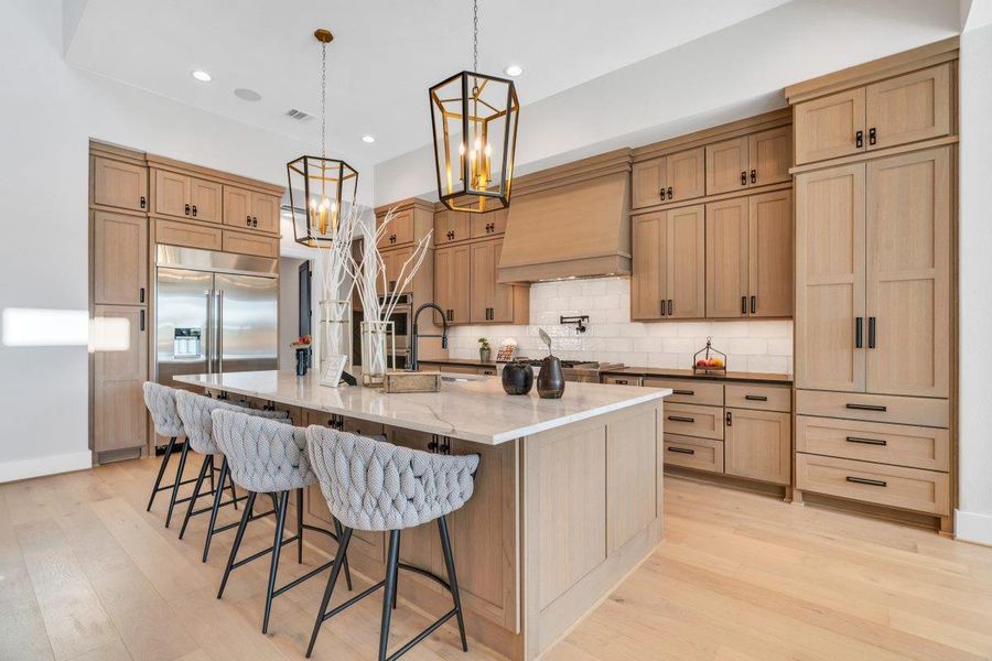 Chef's kitchen featuring high-end appliances Chef's kitchen featuring high-end appliances