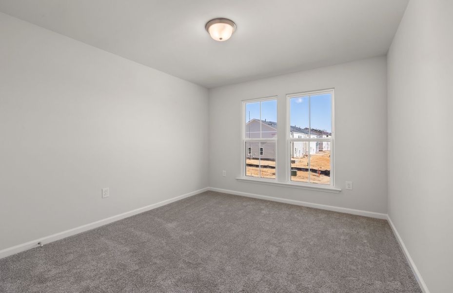 Spacious, unfurnished interior of a new home in Saunders Farm, Willow Spring (Image 22).