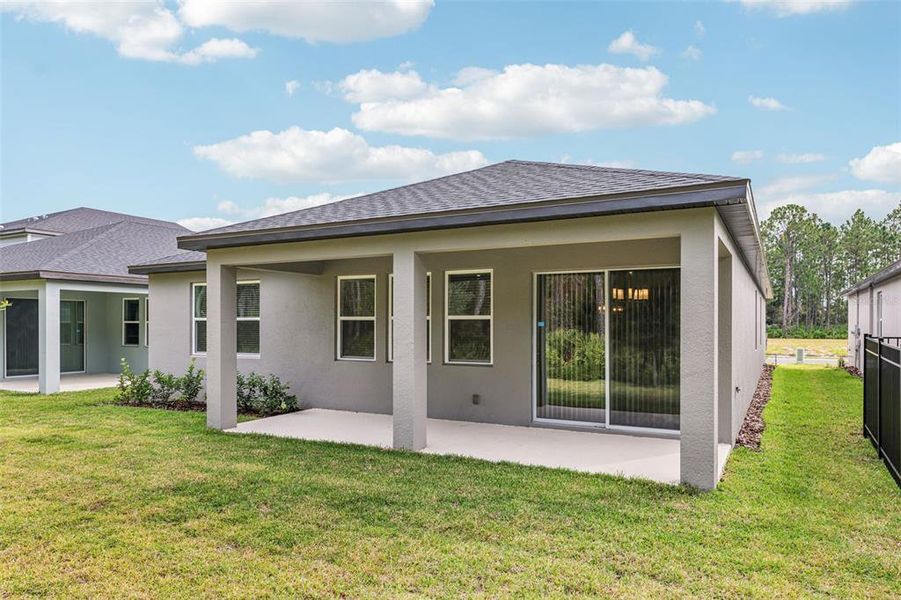 Exterior details and patio area of a home in , Ormond Beach (Image 24).