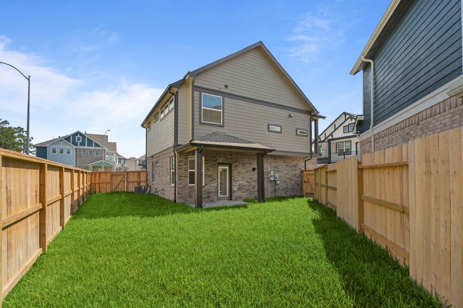 Exterior details and patio area of a home in Balmoral, Humble (Image 2).
