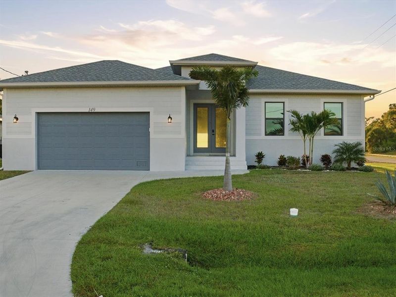 Front exterior of a new home in , Rotonda West, FL, highlighting curb appeal (Image 2).