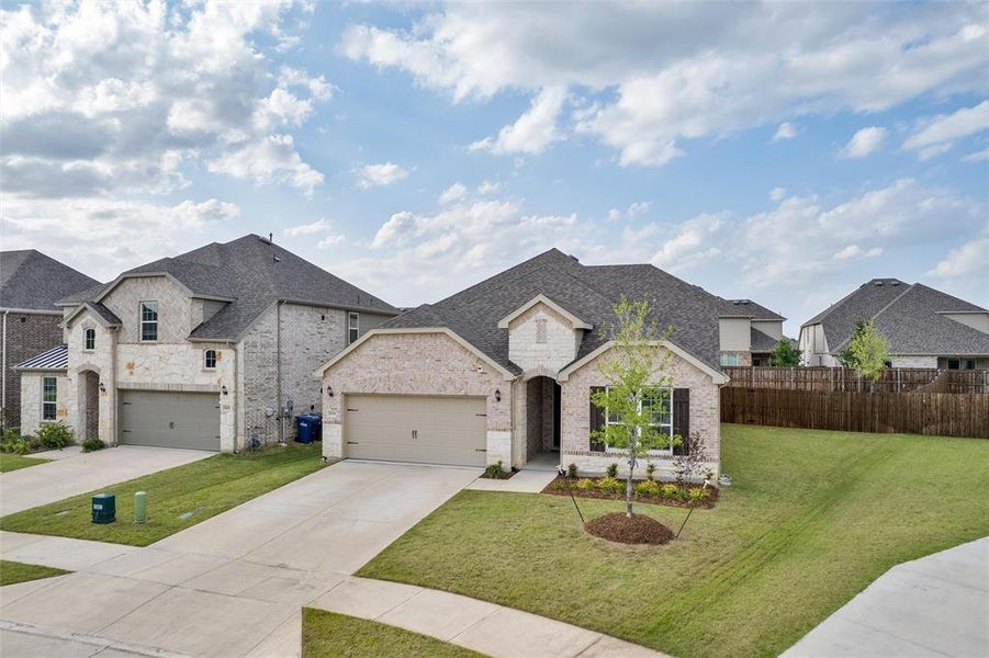 Front exterior of a new home in Erwin Farms, McKinney, TX, highlighting curb appeal (Image 25).