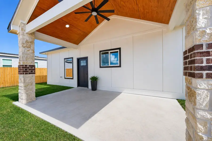 Oversized covered patio featuring a custom ceiling and ample space for outdoor entertaining. Oversized covered patio featuring a custom ceiling and ample space for outdoor entertaining.