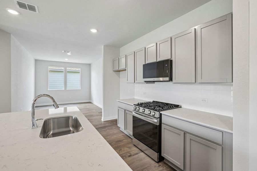 Furnished interior view inside a new home in Stallion Run, Buda (Image 12).