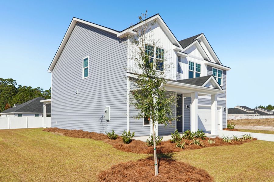 Front exterior of a new home in Hayden Pointe, St. Marys, GA, highlighting curb appeal (Image 18). Front exterior of a new home in Hayden Pointe, St. Marys, GA, highlighting curb appeal (Image 18).
