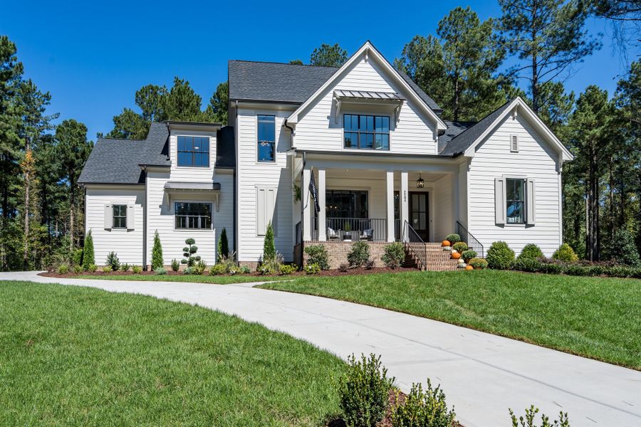 Representative exterior photo of a completed home built from the Brinkley American Farmhouse by Homes by Dickerson in Cattail, Clayton, NC (Image 11).