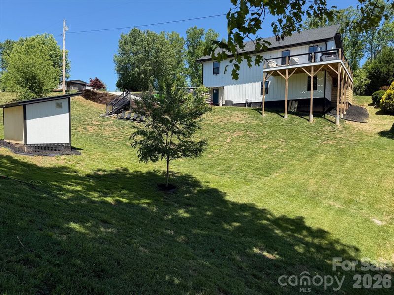 Back Yard and back View with view of Wrap around deck Back Yard and back View with view of Wrap around deck