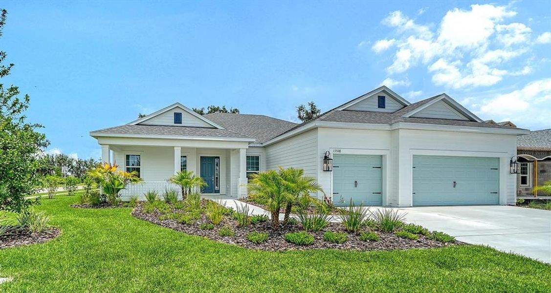 Front exterior of a new home in Canoe Creek, Parrish, FL, highlighting curb appeal (Image 1). Front exterior of a new home in Canoe Creek, Parrish, FL, highlighting curb appeal (Image 1).