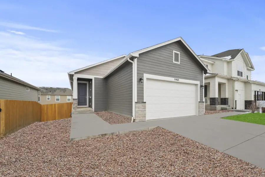 Front exterior of a new home in Ridge at Lorson Ranch, Colorado Springs, CO, highlighting curb appeal (Image 2).