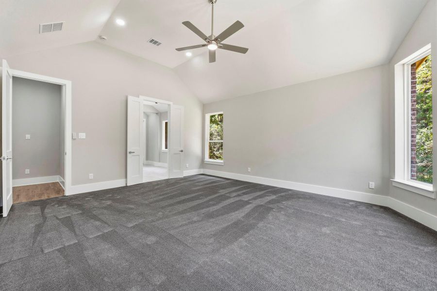 Tucked away for privacy, the spacious primary suite offers a quiet place to recharge. Pre-wired for security keypad.
