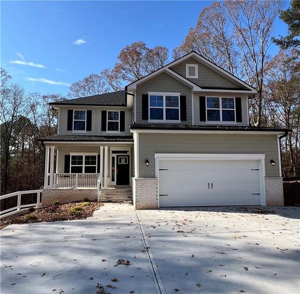 Front exterior of a new home in The Fields of Walnut Creek, Pendergrass, GA, highlighting curb appeal (Image 1).