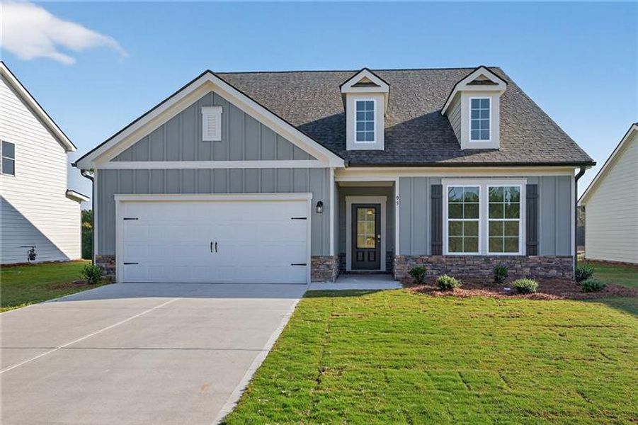 Front exterior of a new home in Sutton's Landing, Statham, GA, highlighting curb appeal (Image 18).