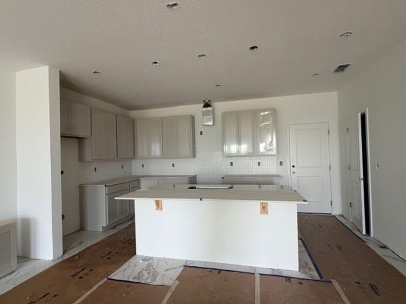 In-progress construction of a new home in Whaley Grove Townhomes, St. Cloud, FL (Image 11).