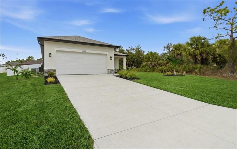 Front exterior of a new home in , North Port, FL, highlighting curb appeal (Image 31).
