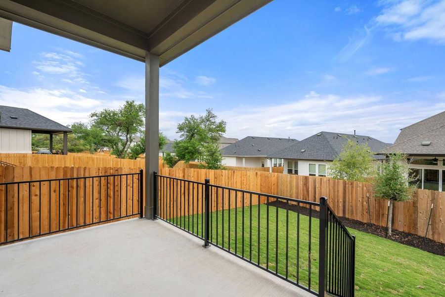 Exterior details and patio area of a home in Heritage, Dripping Springs (Image 23).