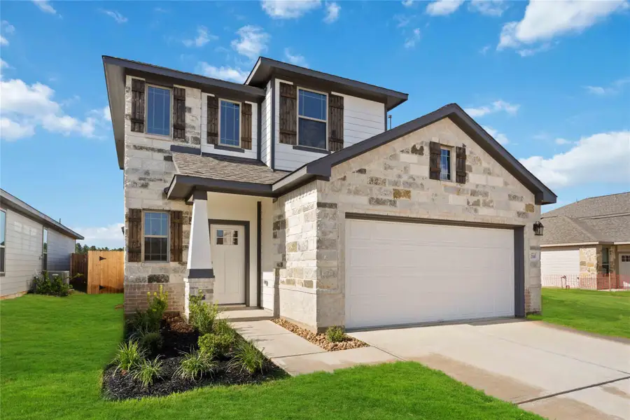 Front exterior of a new home in Magnolia Springs, Montgomery, TX, highlighting curb appeal (Image 2).