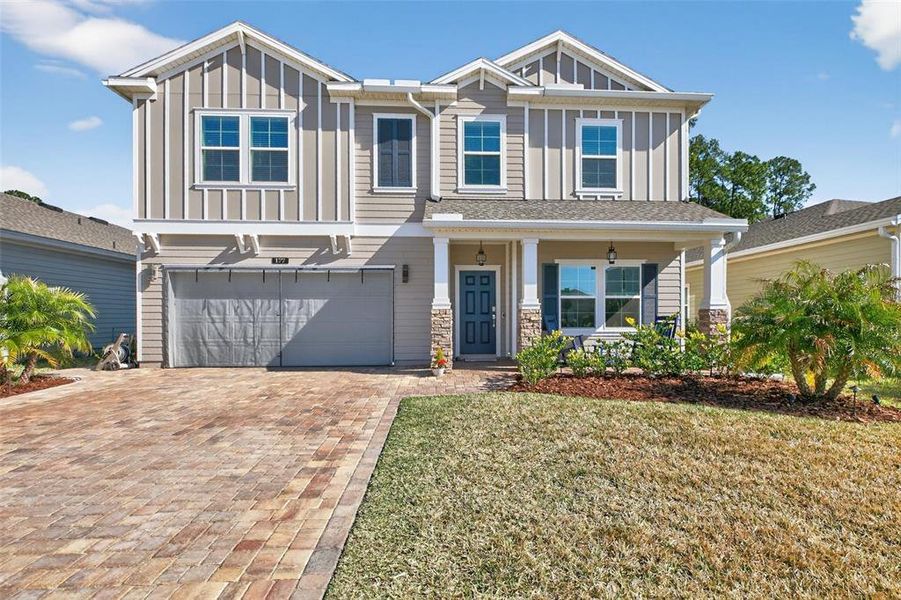 Front exterior of a new home in Trailmark, St. Augustine, FL, highlighting curb appeal (Image 22).