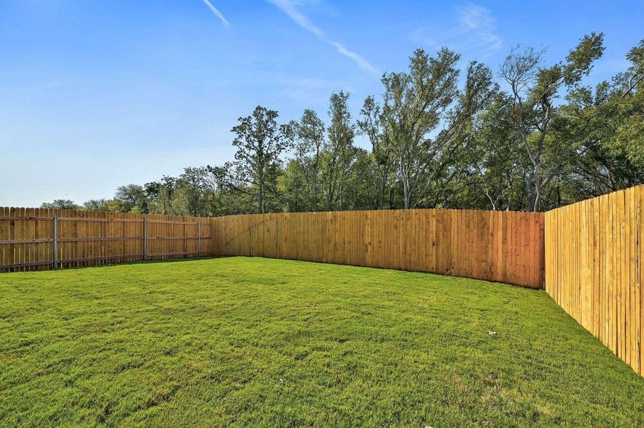 Exterior details and patio area of a home in Trinity Ranch, Elgin (Image 3).