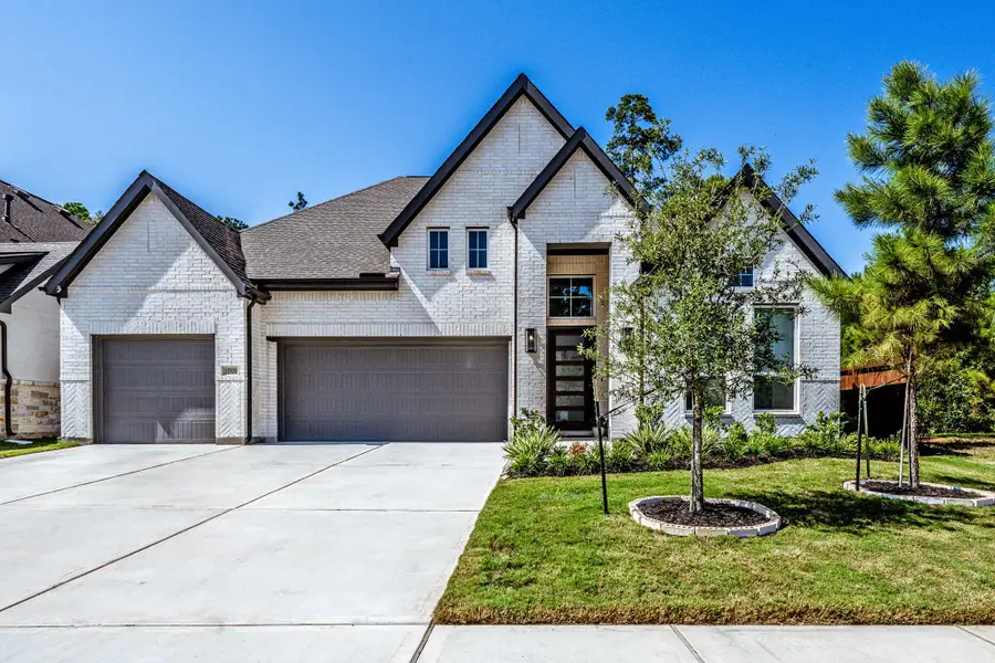 Front exterior of a new home in , Conroe, TX, highlighting curb appeal (Image 22).