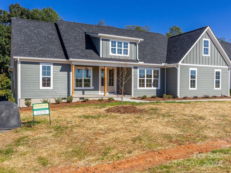 Extensive landscaping shrubs, pine straw & a shade tree.