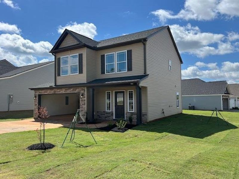 Front exterior of a new home in Cleveland Meadows, Spartanburg, SC, highlighting curb appeal (Image 13).