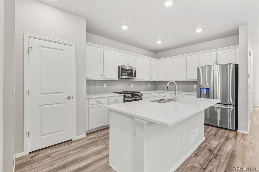Furnished interior view inside a new home in Woodrose at Painted Prairie, Aurora (Image 5).