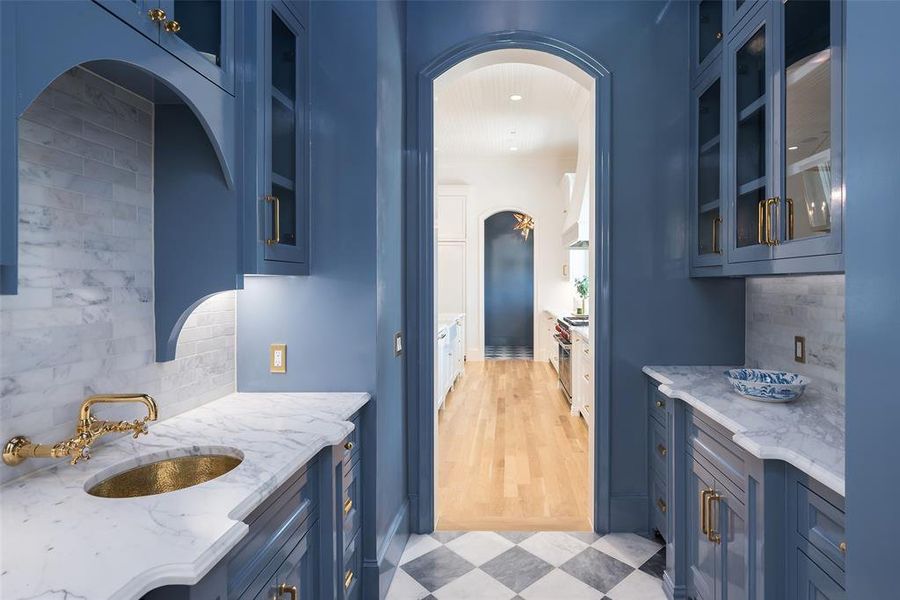 Tasteful backsplash, and hardwood / wood-style floors