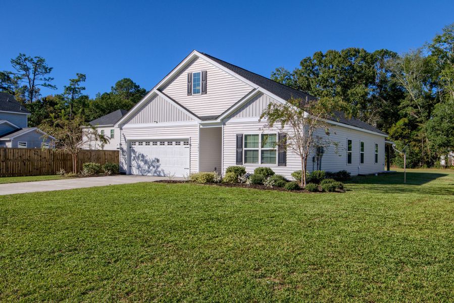 Front exterior of a new home in , Bonneau, SC, highlighting curb appeal (Image 22).