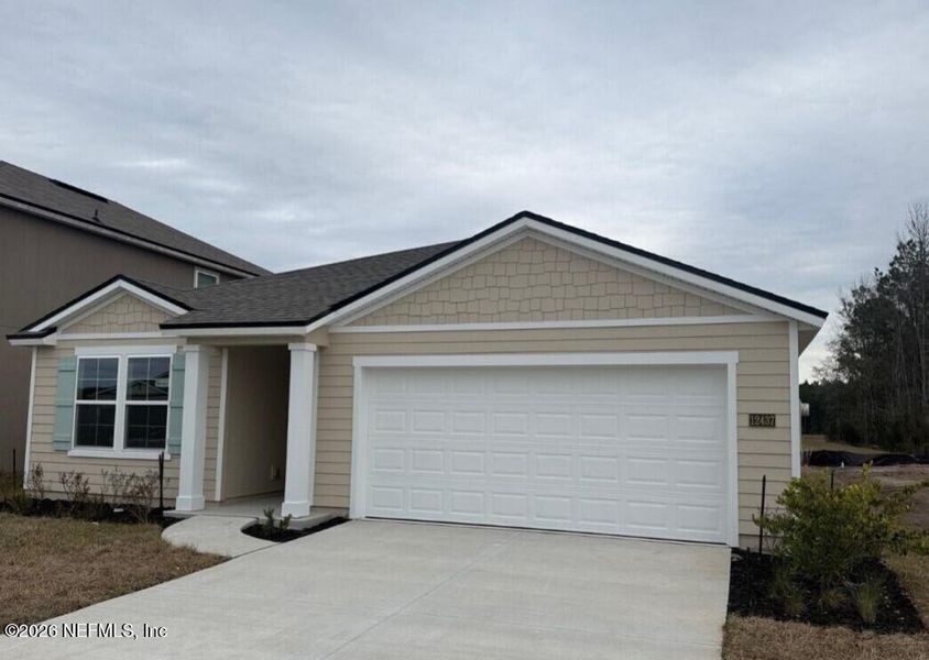 Front exterior of a new home in The Arbors, Jacksonville, FL, highlighting curb appeal (Image 27).