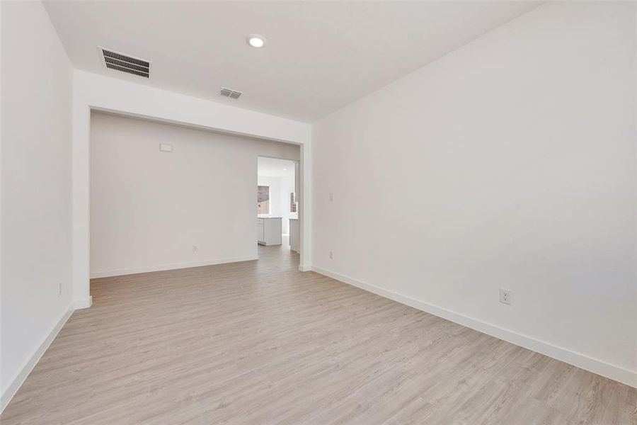 Spare room with light hardwood / wood-style floors