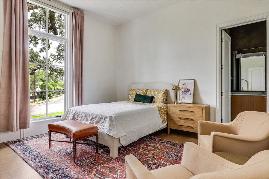 The second downstairs bedroom features an impressive bathroom and walk-in closet. Each bedroom has smart sheers and blackout shades, customizing comfort at the touch of a button.