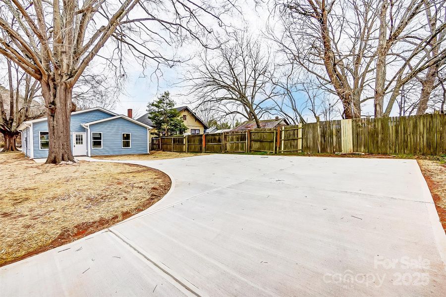 Backyard w/ Back Patio, Walkway, and Driveway