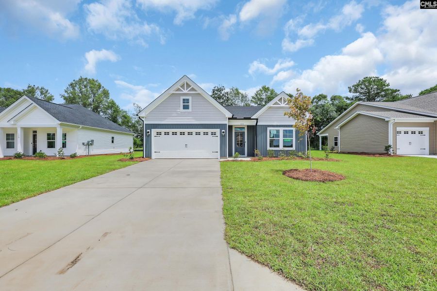 Front exterior of a new home in Raglins Creek, Lugoff, SC, highlighting curb appeal (Image 1).
