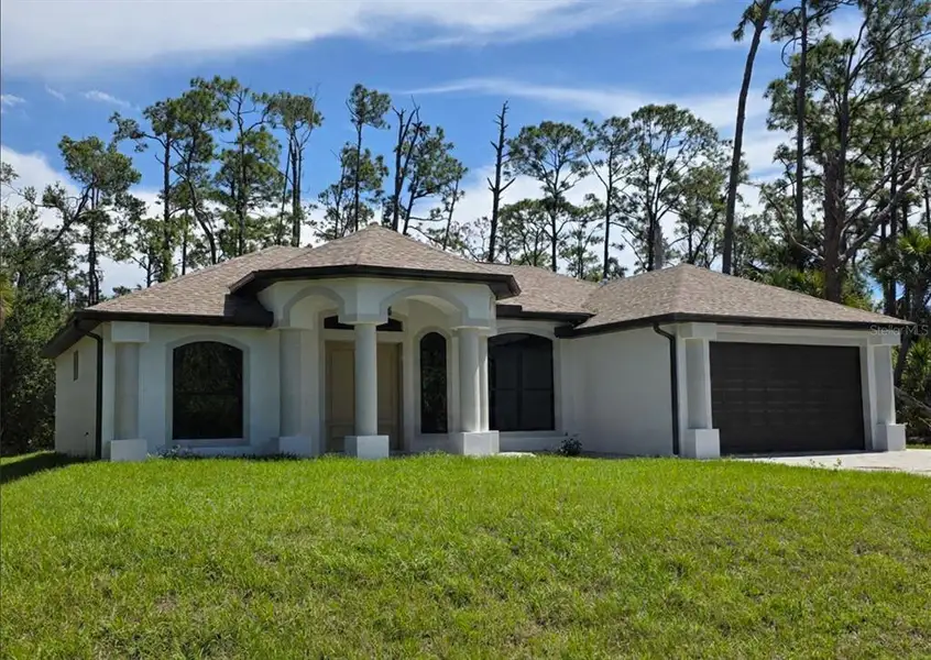 Front exterior of a new home in , Port Charlotte, FL, highlighting curb appeal (Image 1). Front exterior of a new home in , Port Charlotte, FL, highlighting curb appeal (Image 1).