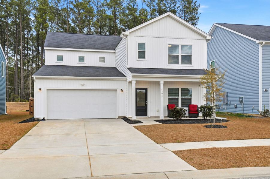 Front exterior of a new home in Watson Hill, Summerville, SC, highlighting curb appeal (Image 24).