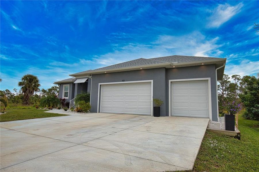 Front exterior of a new home in , Rotonda West, FL, highlighting curb appeal (Image 2).