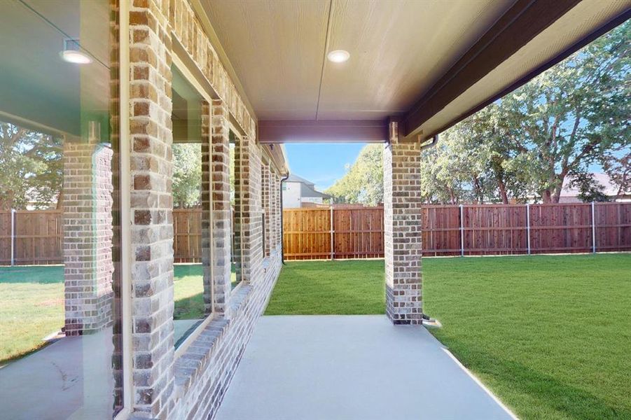 Exterior details and patio area of a home in Vintage Village, Argyle (Image 16).