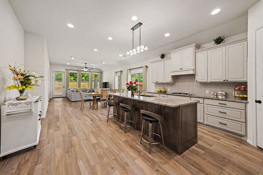 Fantastic kitchen presents stunning granite countertops, lots of cabinet space, and breakfast bar seating. Fantastic kitchen presents stunning granite countertops, lots of cabinet space, and breakfast bar seating.