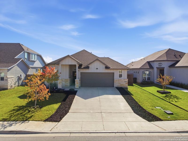 Front exterior of a new home in August Fields, New Braunfels, TX, highlighting curb appeal (Image 18). Front exterior of a new home in August Fields, New Braunfels, TX, highlighting curb appeal (Image 18).