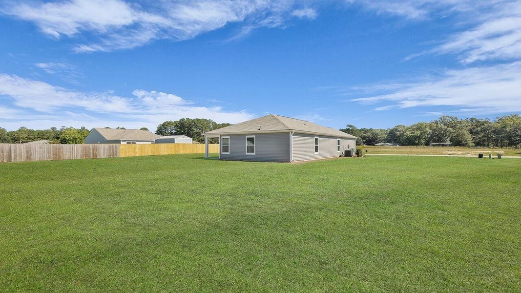 Exterior details and patio area of a home in Evergreen, Holly Hill (Image 17).