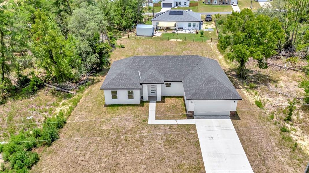 Front exterior of a new home in , Ocala, FL, highlighting curb appeal (Image 17).